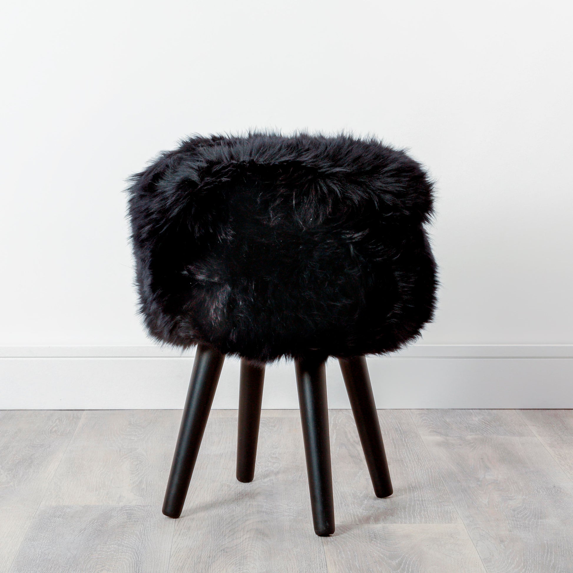 Black Genuine Sheepskin Wood Stool - Black Legs - CasaFenix